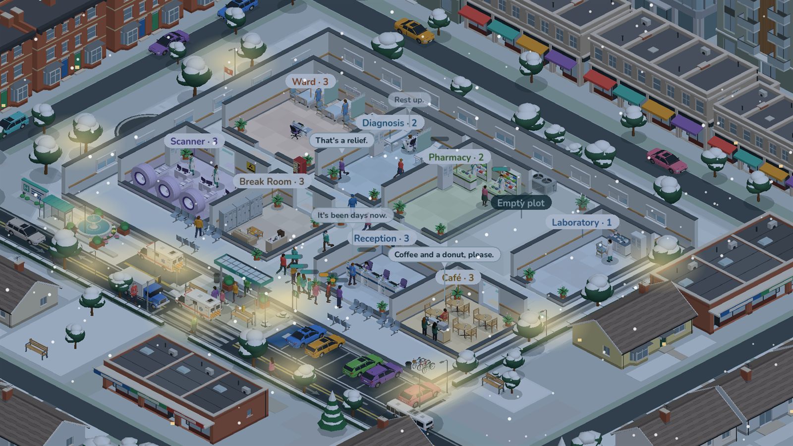 The hospital on a winter night, snow falling and the lights on